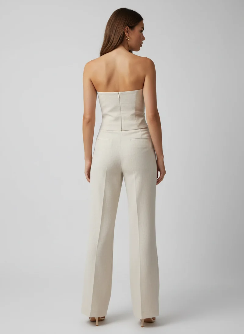 Ensemble pantalon élégant avec débardeur boutonné