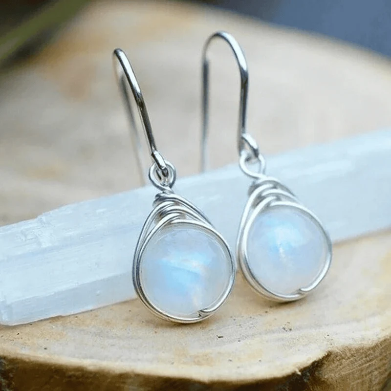 Boucles d'oreilles pendantes en pierre de lune argentée