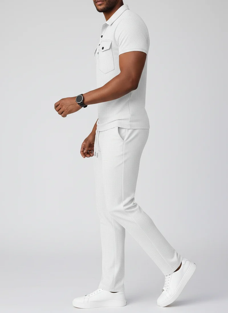 Ensemble polo texturé poches pantalon
