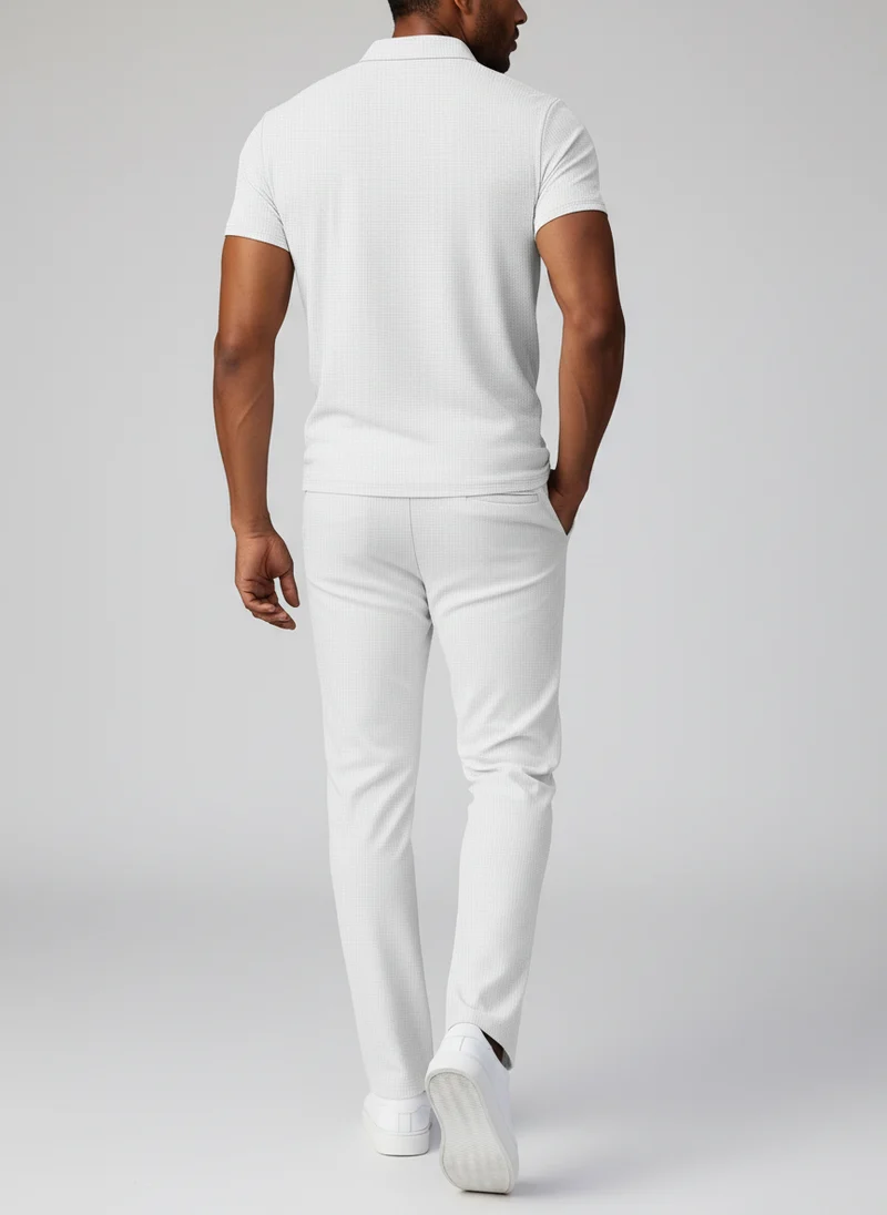 Ensemble polo texturé poches pantalon