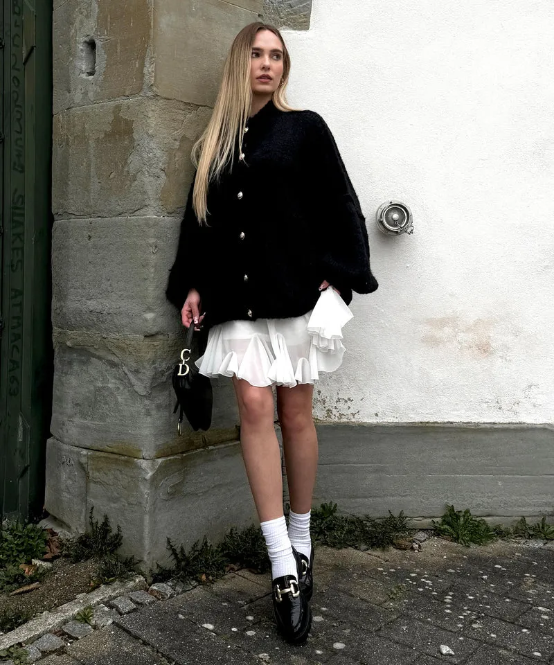 Veste en tricot oversize noire au style cosy