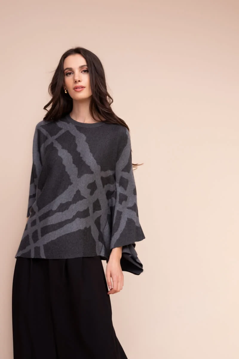 Cape en tricot à motif abstrait
