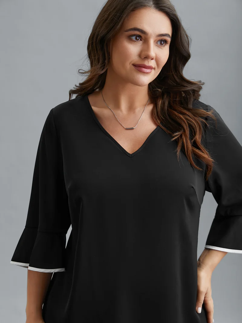 Color-Block Spliced Ruffled Overlap Hem Blouse