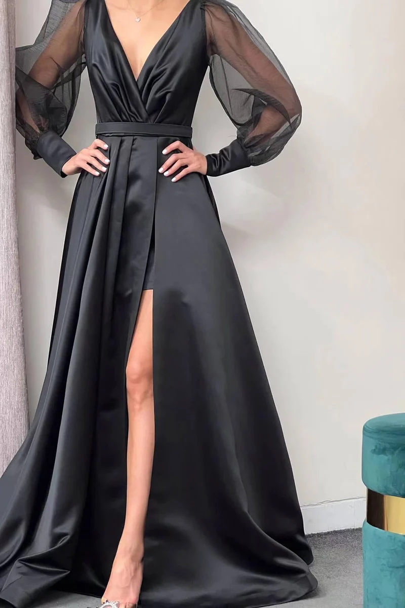 Robe de soirée élégante à manches longues bouffantes et coupe trapèze avec fente sur la cuisse