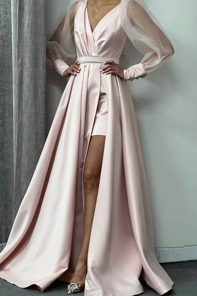 Robe de soirée élégante à manches longues bouffantes et coupe trapèze avec fente sur la cuisse
