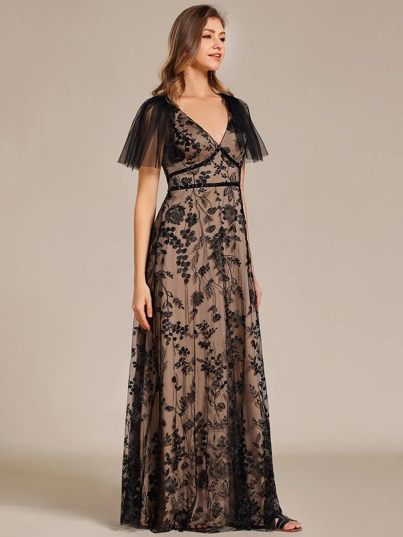 Robe longue de soirée en maille brodée à manches évasées