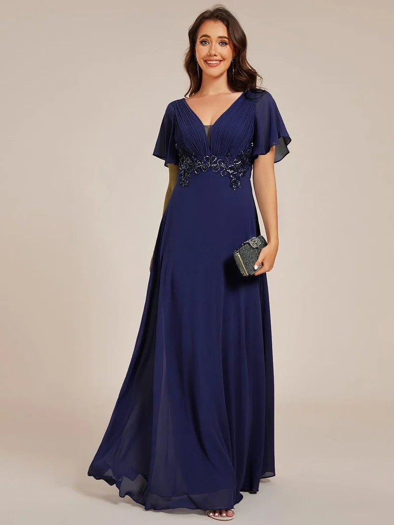 Robe de soirée longue à col en V et appliques à la taille grande taille