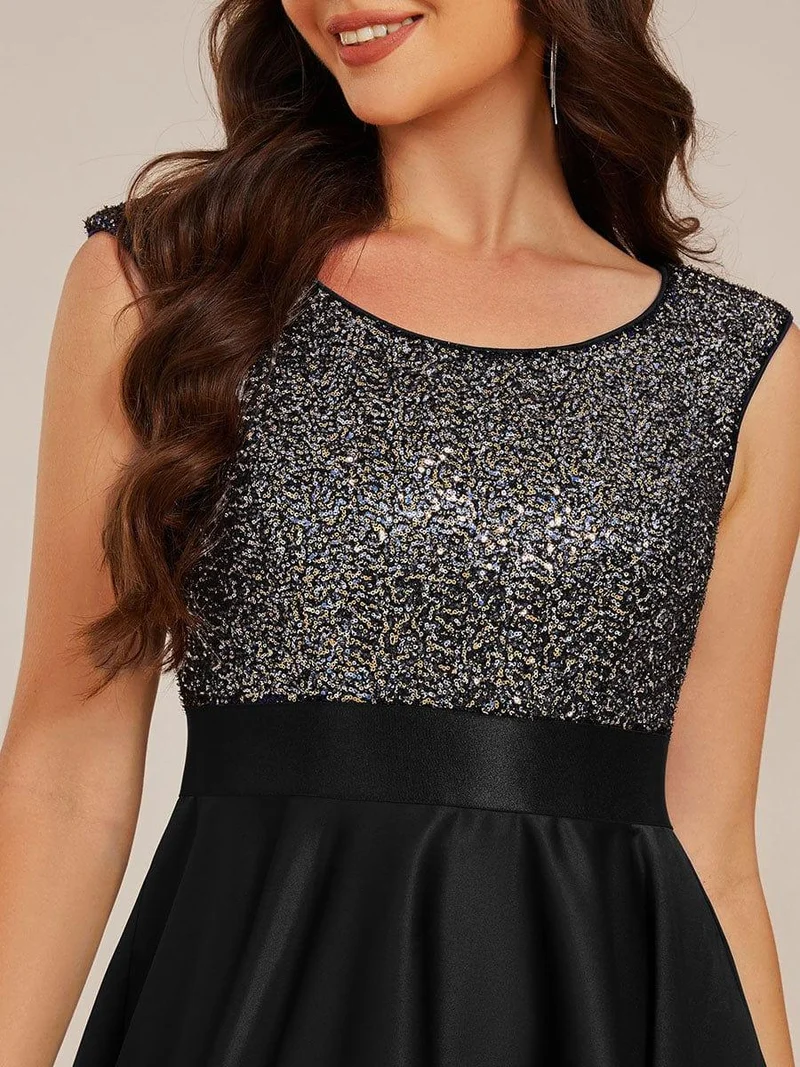 Robe de soirée à sequins et décolleté plongeant avec satin