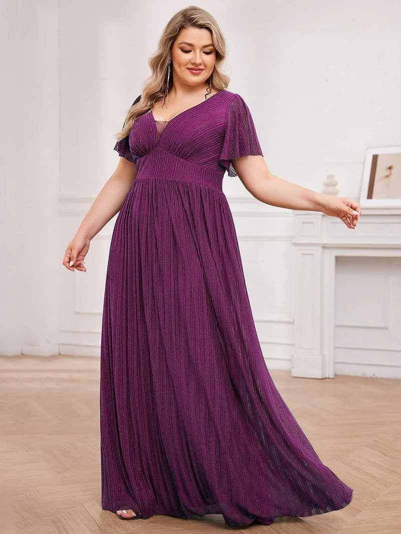 Robe de soirée transparente scintillante col en V taille empire manches courtes