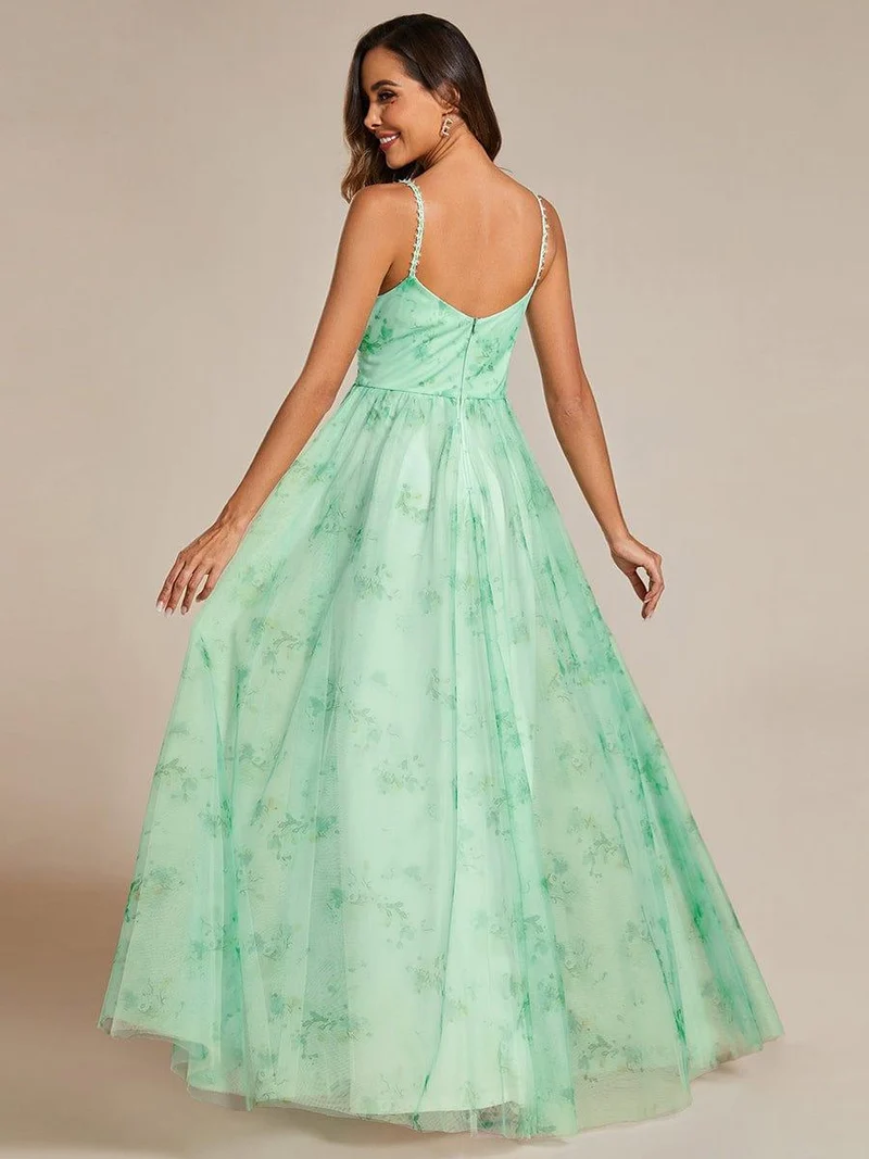 Robe de soirée florale à bretelles spaghetti et taille empire avec col en V