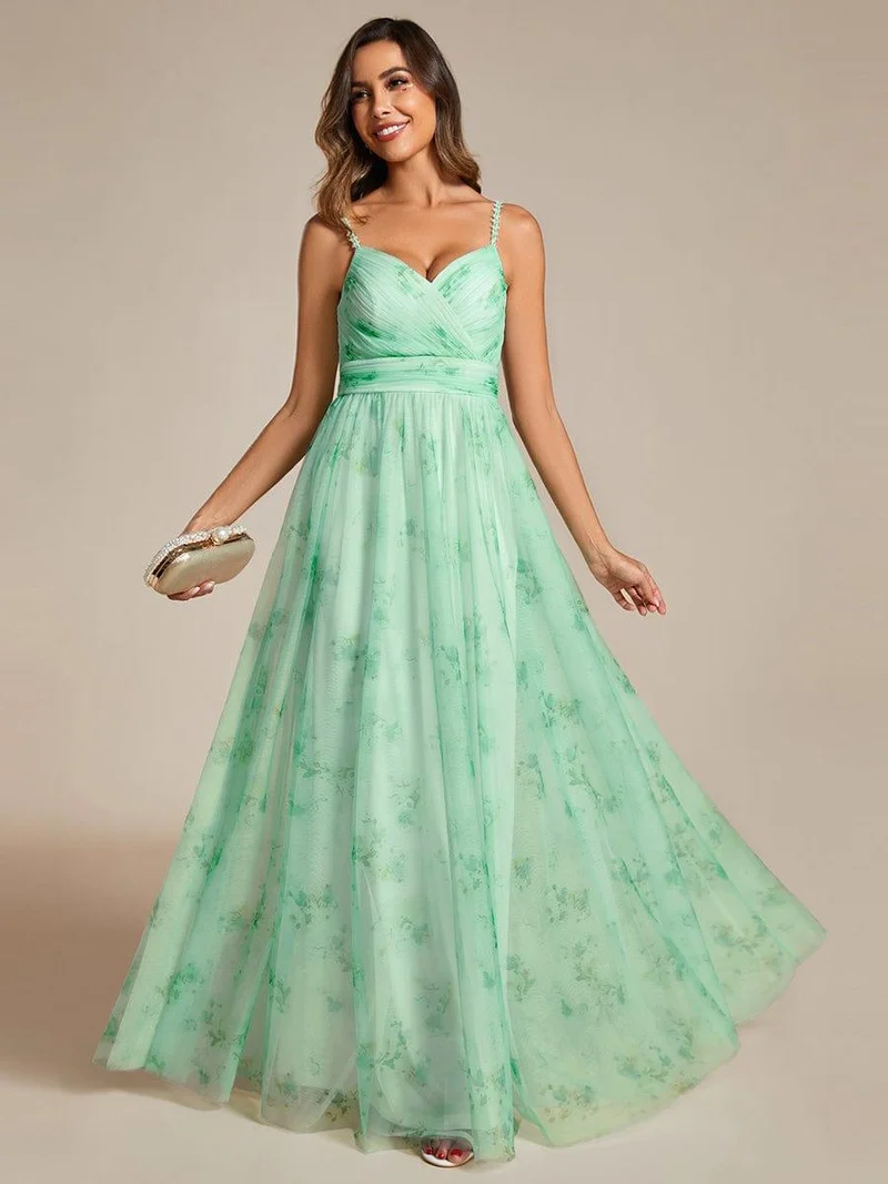 Robe de soirée florale à bretelles spaghetti et taille empire avec col en V
