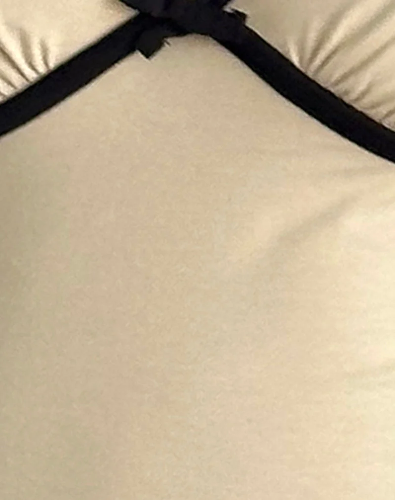 Top Tasina en lait de coco avec bordure noire