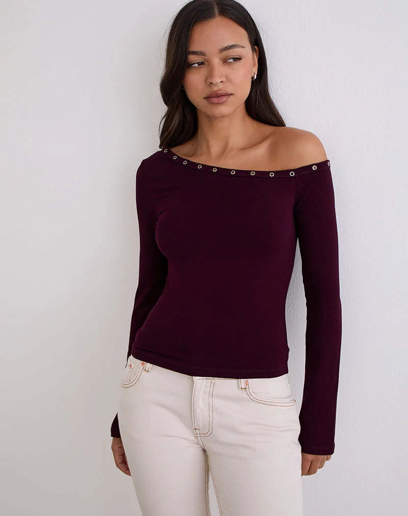 Top asymétrique Noraba en bois rouge avec œillets