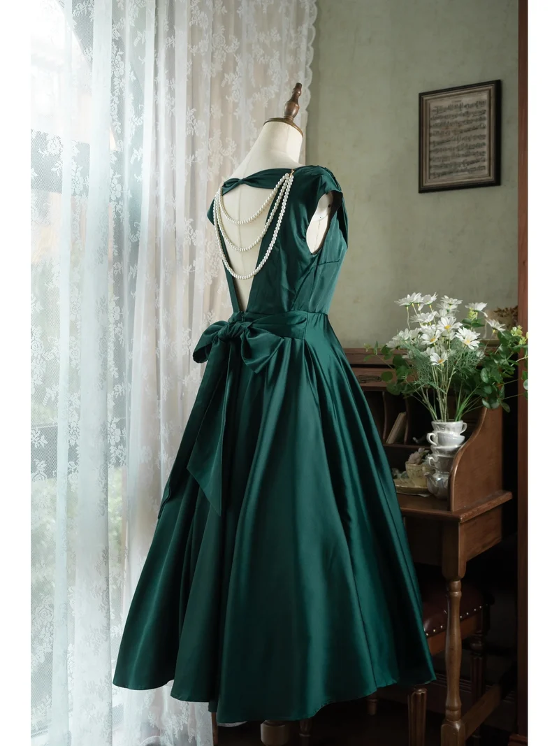 Robe vert émeraude vintage à col bénitier et dos ouvert des années 50