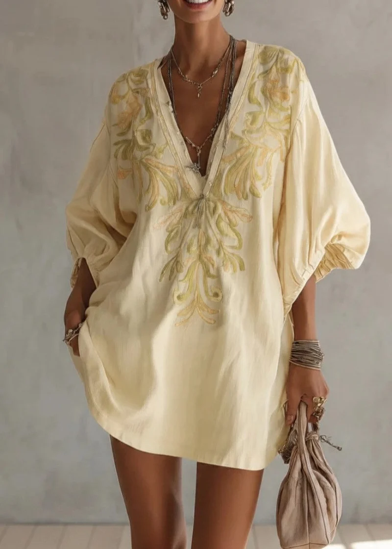 Robe jaune à manches lanternes et broderie