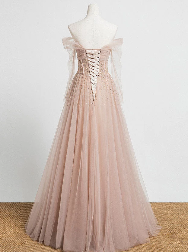 Robe de soirée longue en tulle rose champagne ornée de perles et soutien-gorge intégré