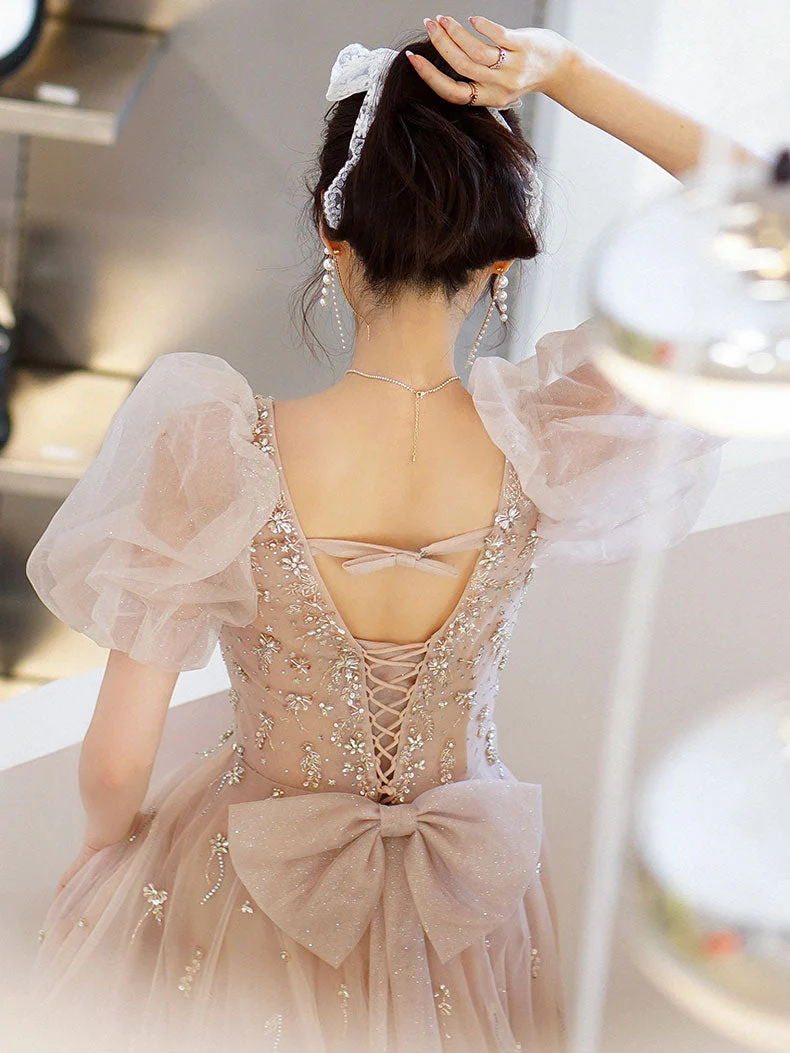 Robe de soirée longue en tulle champagne et perles