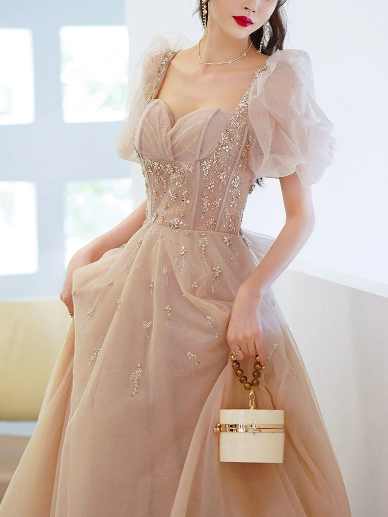 Robe de soirée longue en tulle champagne et perles