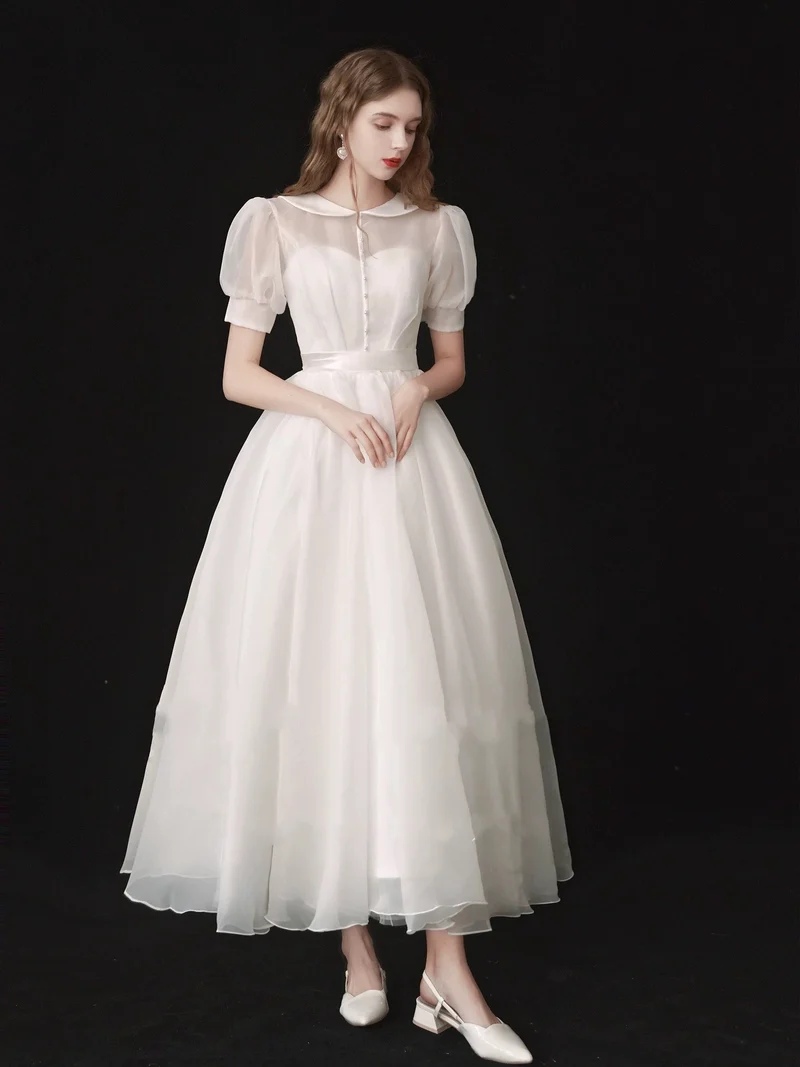 Robe de mariée modeste en organza longueur thé années 50 avec manches courtes