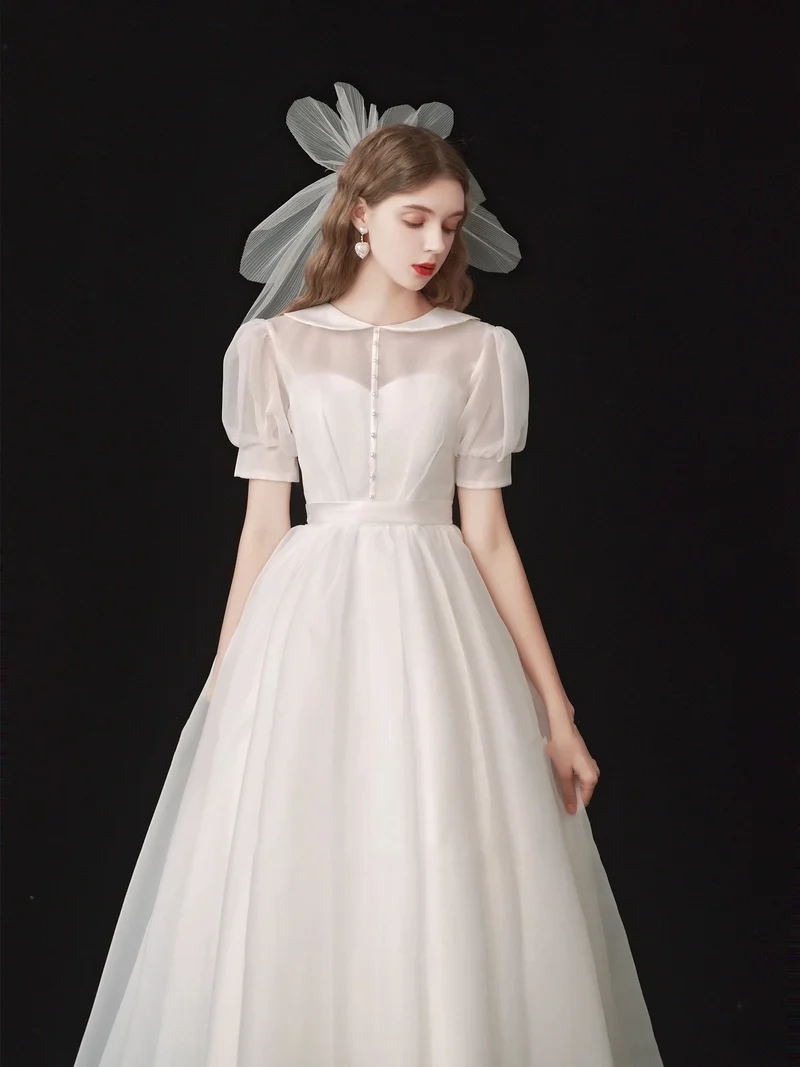 Robe de mariée modeste en organza longueur thé années 50 avec manches courtes