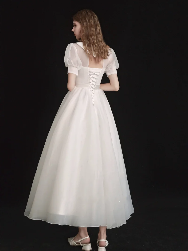 Robe de mariée modeste en organza longueur thé années 50 avec manches courtes