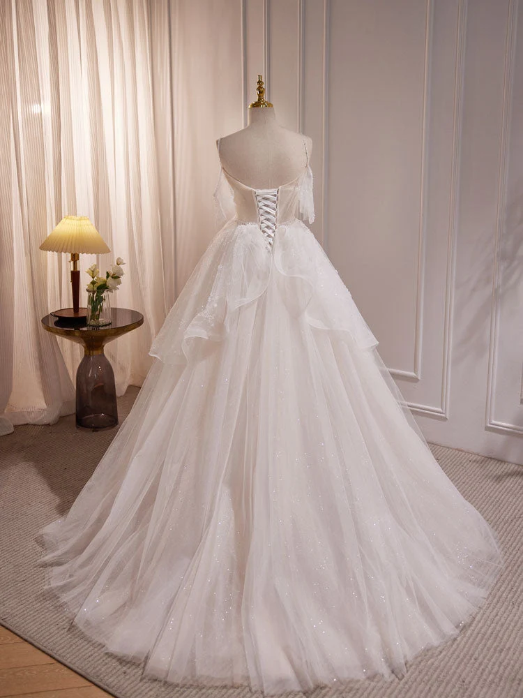 Robe de mariée transparente en tulle avec bretelles spaghetti et épaules dénudées