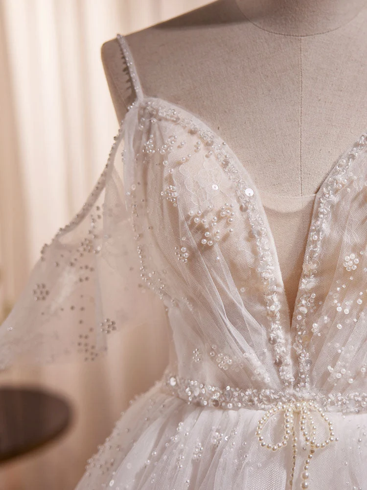 Robe de mariée transparente en tulle avec bretelles spaghetti et épaules dénudées