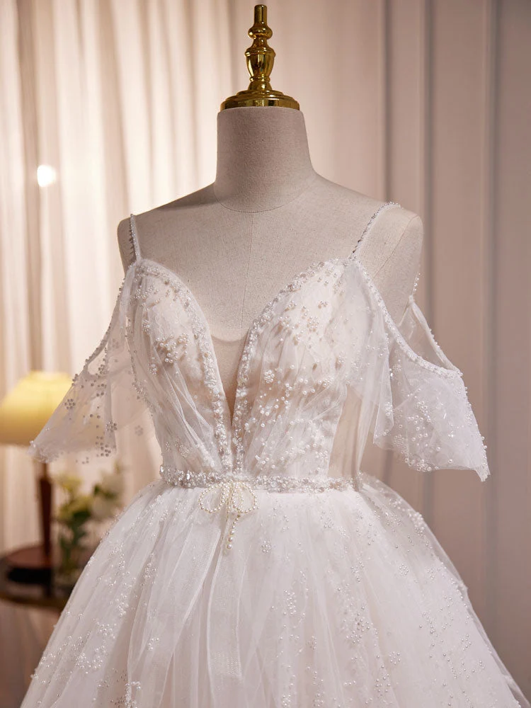 Robe de mariée transparente en tulle avec bretelles spaghetti et épaules dénudées