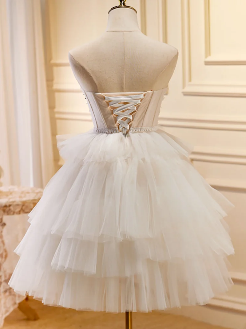 Jolie robe de soirée en tulle transparent sans bretelles blanche