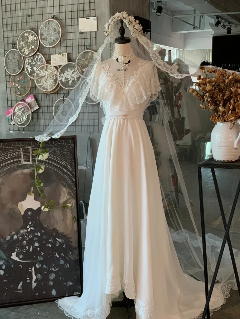Robe de mariée vintage en dentelle et mousseline à manches longues