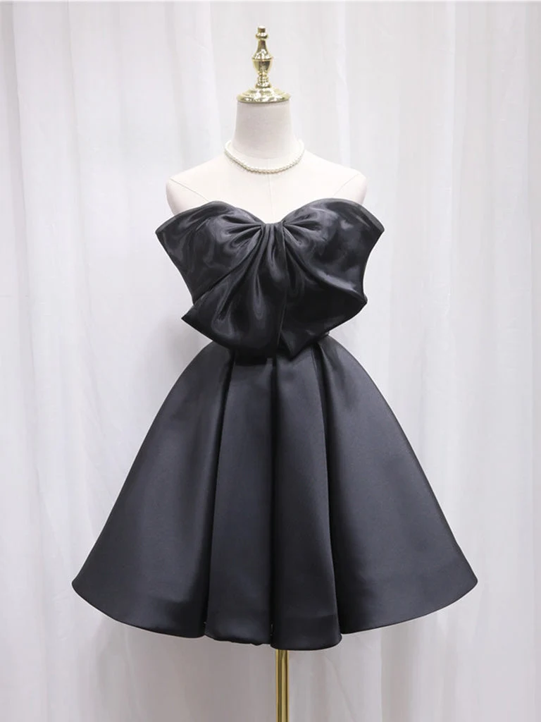 Adorable robe de soirée trapèze noire avec gros nœud sur le devant