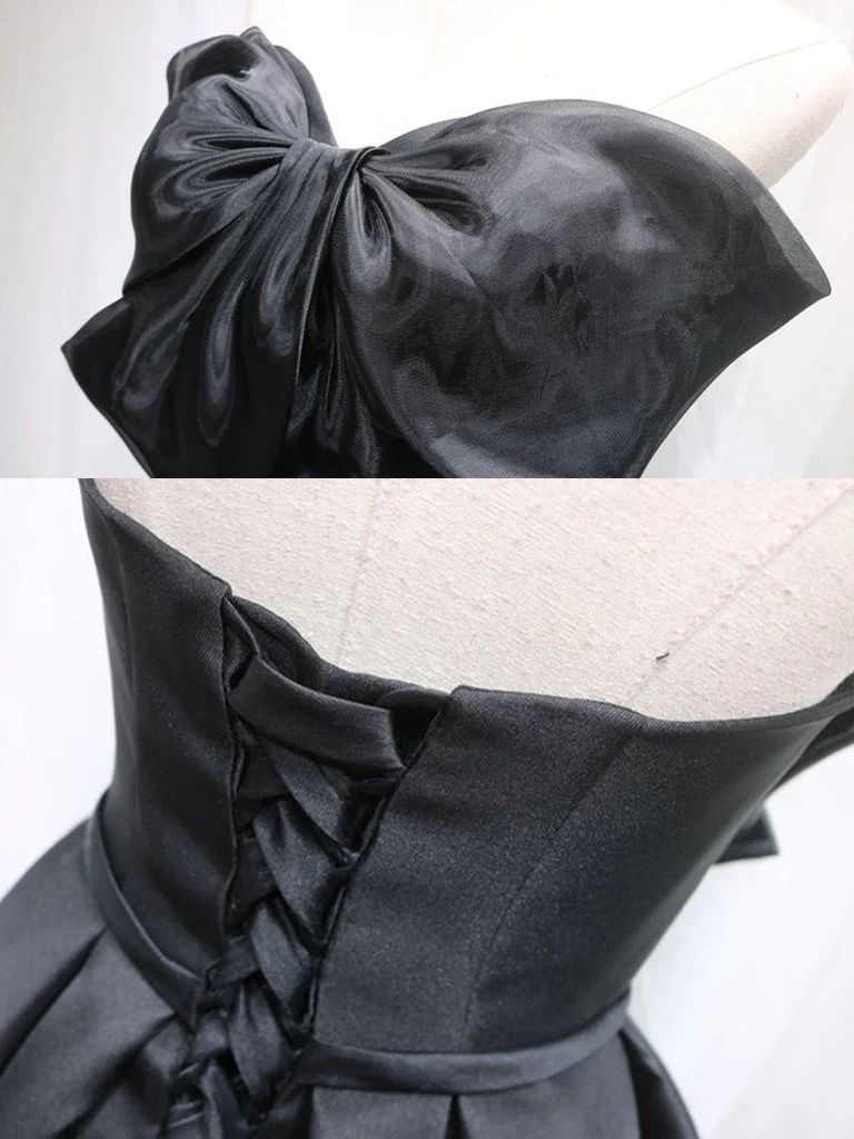 Adorable robe de soirée trapèze noire avec gros nœud sur le devant