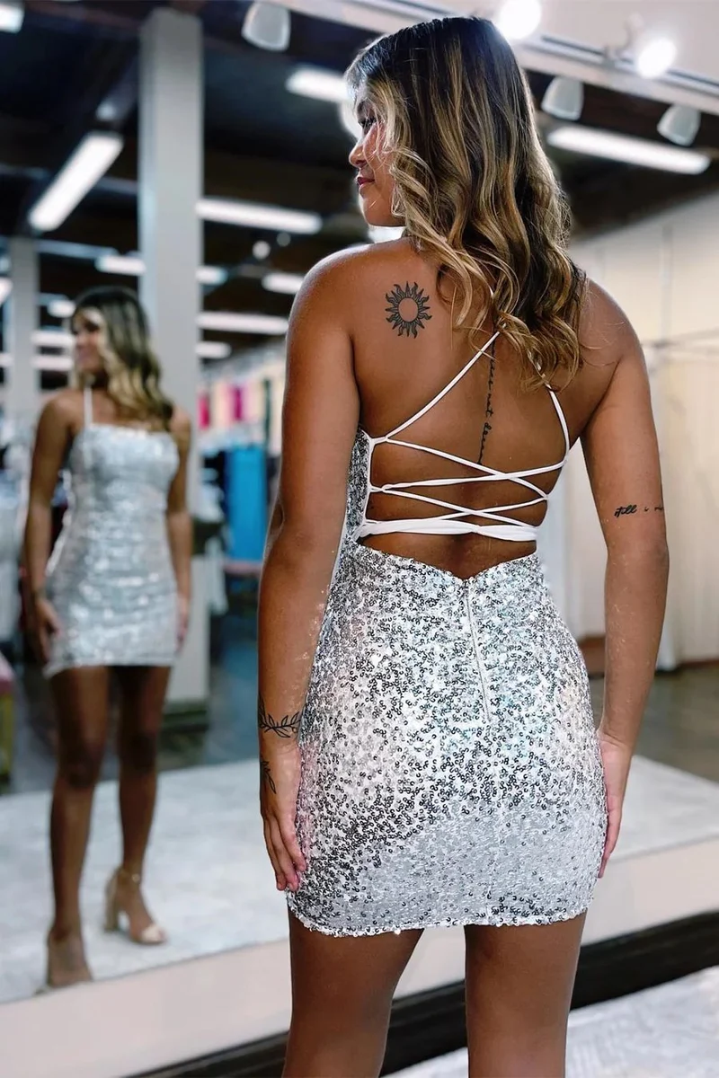Robe de soirée moulante à nouer dans le dos et paillettes argentées
