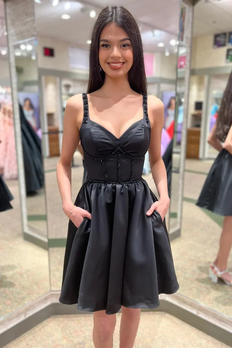 Robe de soirée avec haut corset perlé noir et poches
